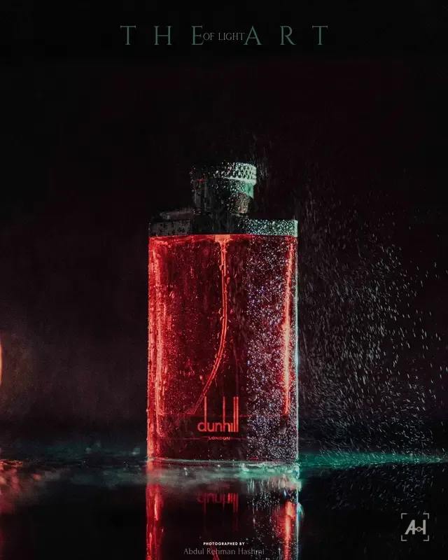 Dunhill Desire Red lit crimson in falling water, from The Art of Light series