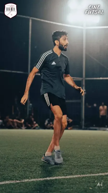 A bearded player in Adidas black reading the game under the lights